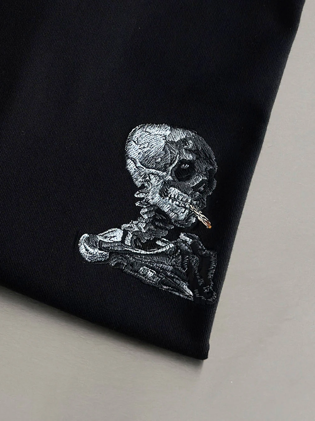 Skull Of A Skeleton With Burning Cigarette